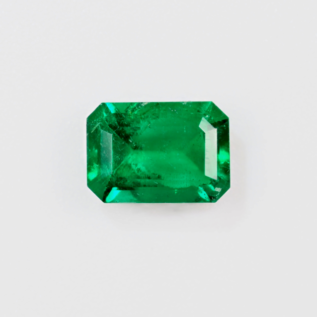 0.56 carat natural Panjshir emerald, front view on white background