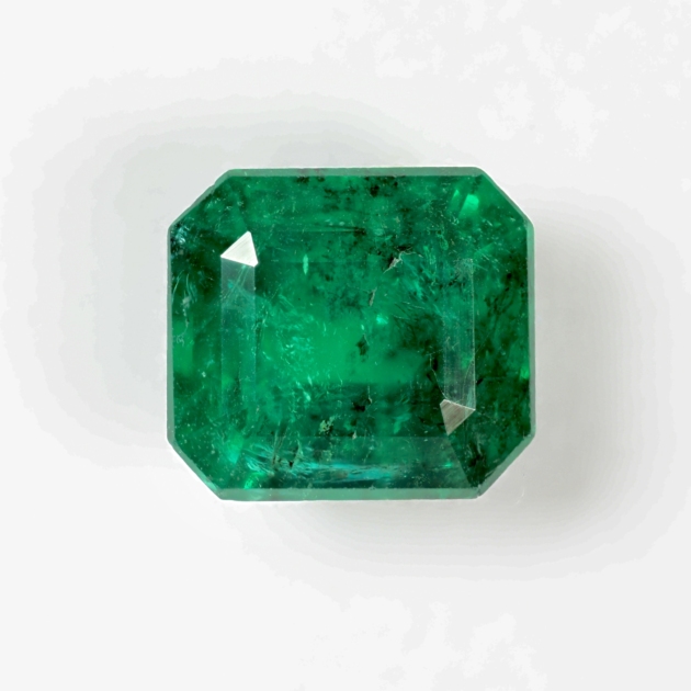 [carat] carat natural Zambian emerald, Guild Certified, front view on white background