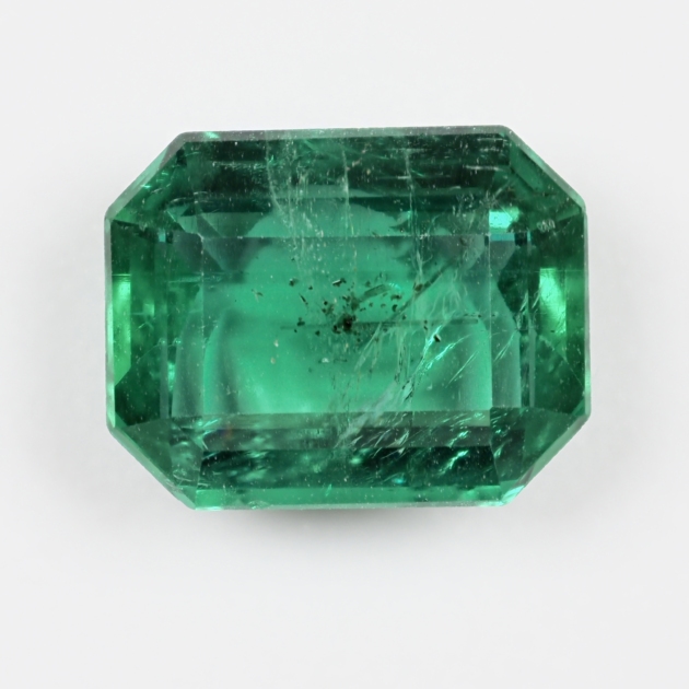 2.16 carat natural Zambian emerald, Guild Certified, photographed loose on a white background
